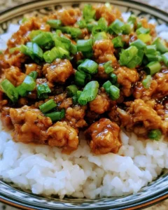 Honey garlic ground turkey dish garnished with herbs and served on a plate.