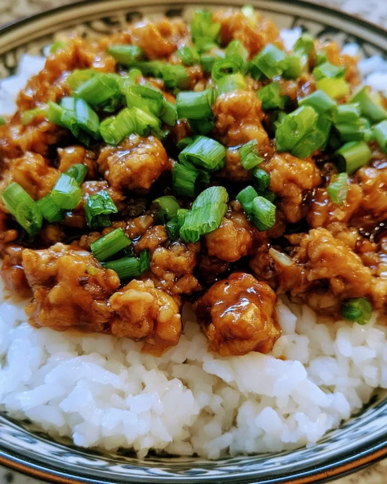 Honey garlic ground turkey dish garnished with herbs and served on a plate.