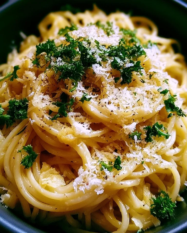 Delicious plate of Garlic Parmesan Pasta garnished with parsley and cheese